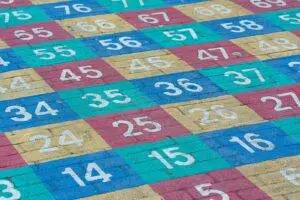 Vibrant numbered grid on a concrete surface outdoors. Perfect for educational materials.
