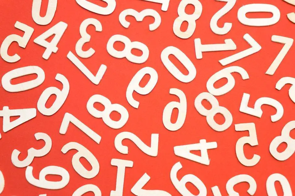 Artistic scattered white numbers on a bright red background, geometric and abstract.