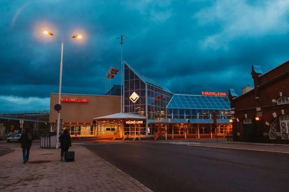 Dramatic view of Viking Line ferry terminal in Turku, Finland at twilight, showcasing urban architecture.