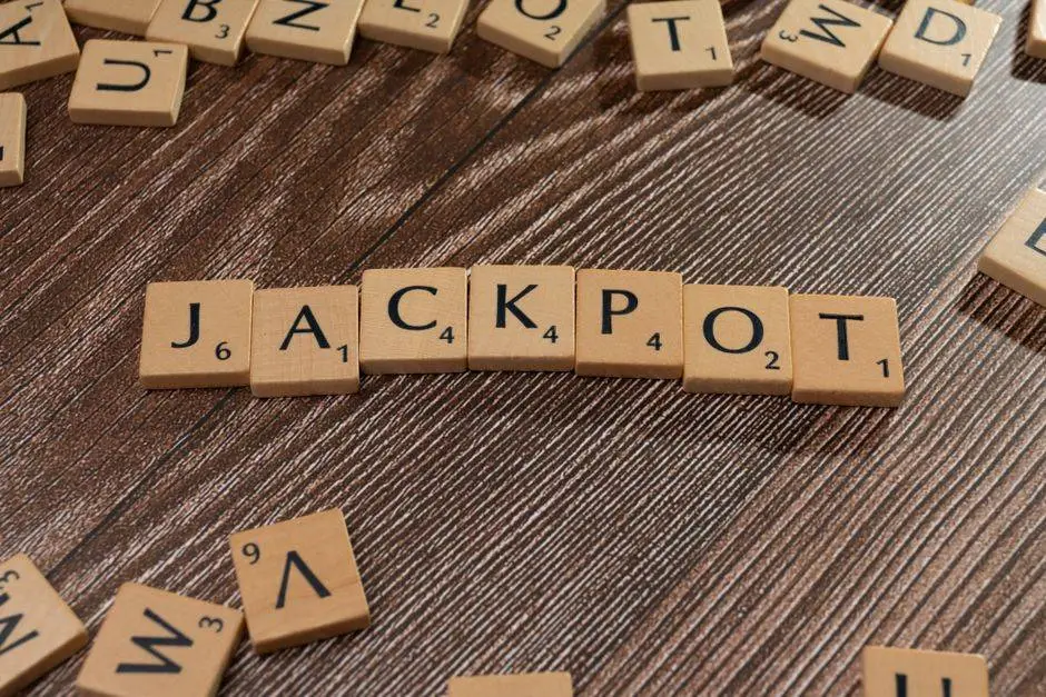 Wooden letter tiles spelling 'JACKPOT' on a textured wooden surface, representing winning or success.