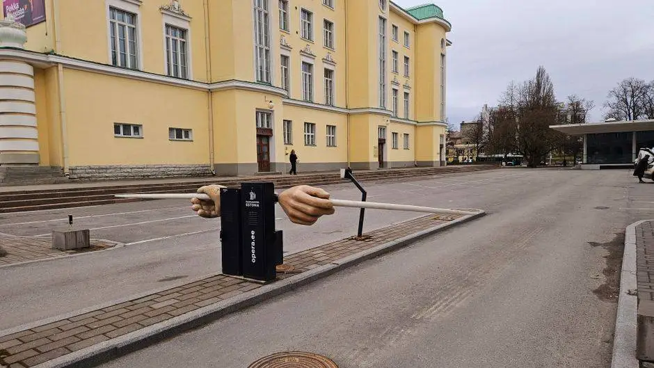 Sculpture of hands holding a bar in front of the Estonian National Opera in Tallinn, Estonia.