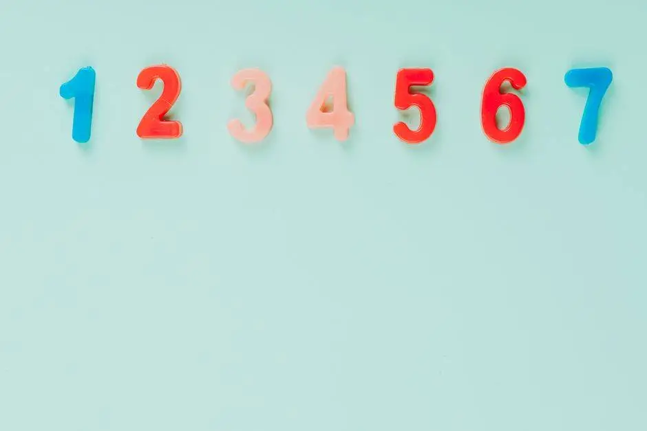 Bright plastic numbers on a blue background with ample copy space, ideal for educational themes.